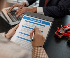 woman signing car insurance contract
